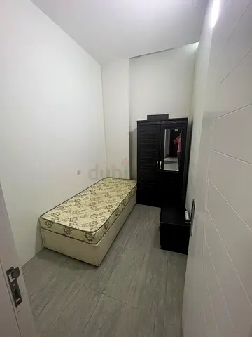 Small partition room furnished in clean apartment located in Deira