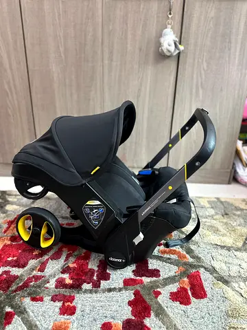 Doona stroller and car seat with travel bag