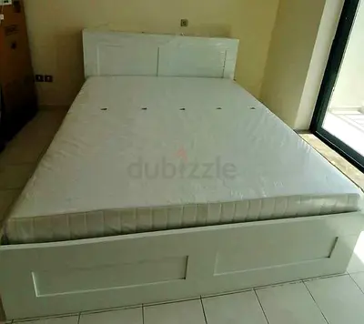 Ikea brimness king bed with headboard 4  drawers underneath and Ikea mattress .