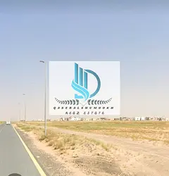 Corner plot of land for sale in the Emirate of Sharjah, Al Sahmah area, Al Ruwaidat suburb