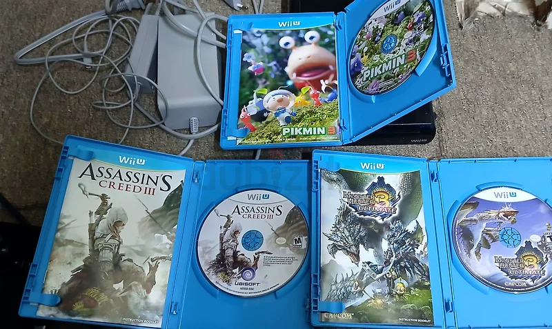 Nintendo Wii U console, black version with 32GB storage, comes with original adapters and three almost new games.63205880848257113
