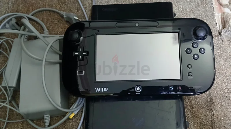 Nintendo Wii U console, black version with 32GB storage, comes with original adapters and three almost new games.63205880848257111