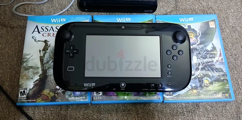 Nintendo Wii U console, black version with 32GB storage, comes with original adapters and three almost new games.63205880848257114