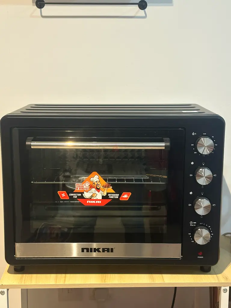 Compact and Stylish Nikai Oven - Perfect for Your Kitchen!