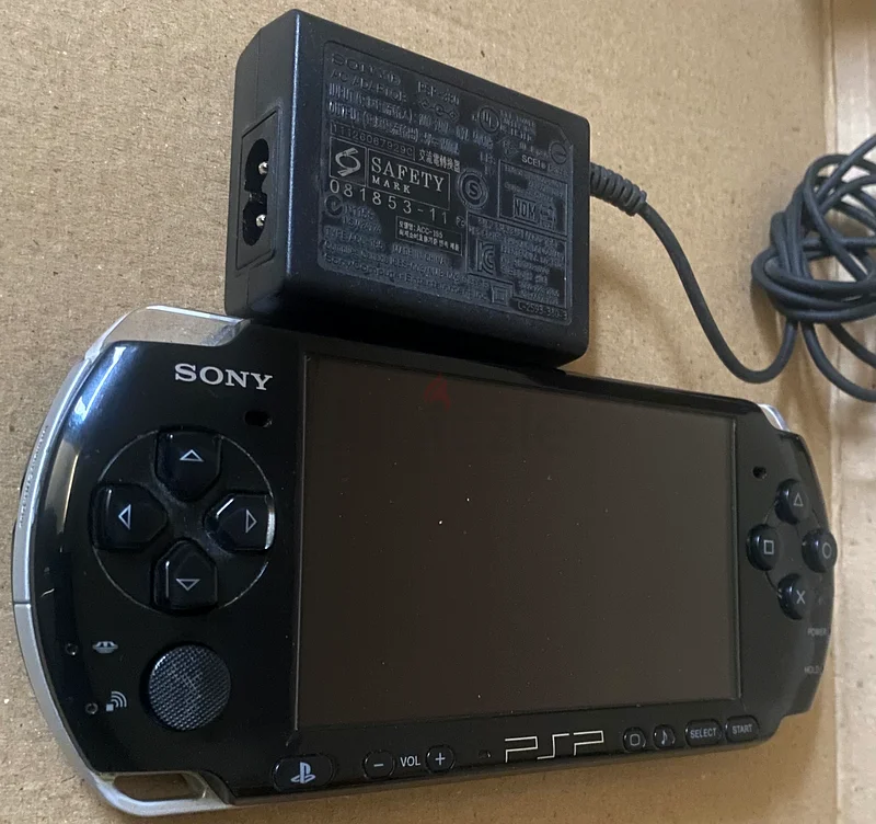 Sony PSP 64 gb+ Original Charger and Games Installed63201163260802113