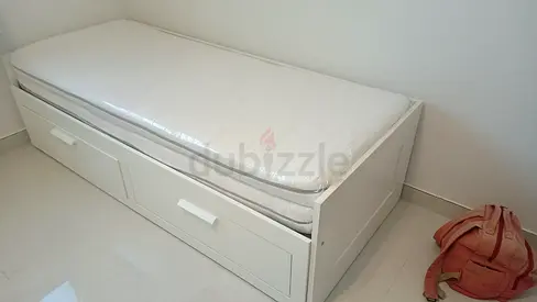 IKEA brimness Day bed with 2 storage drawers underneath and with 2 IKEA mattresses is available