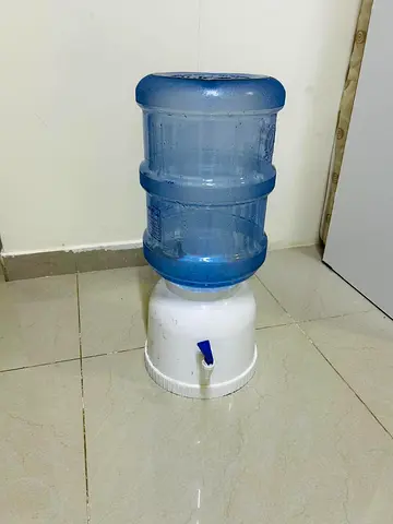 Table top water dispenser with Aqua water bottle