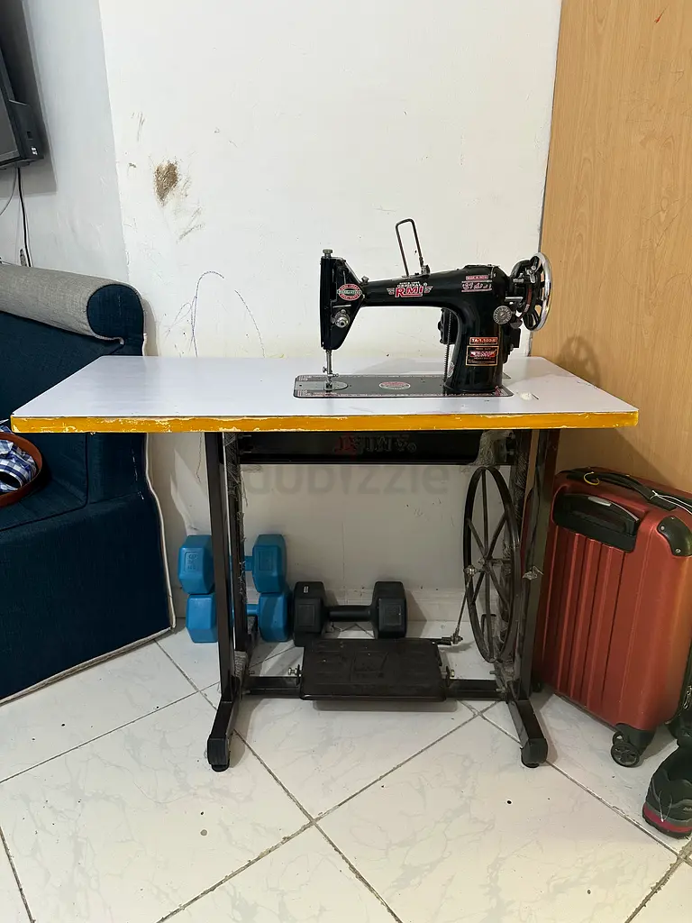 Sewing machine with table