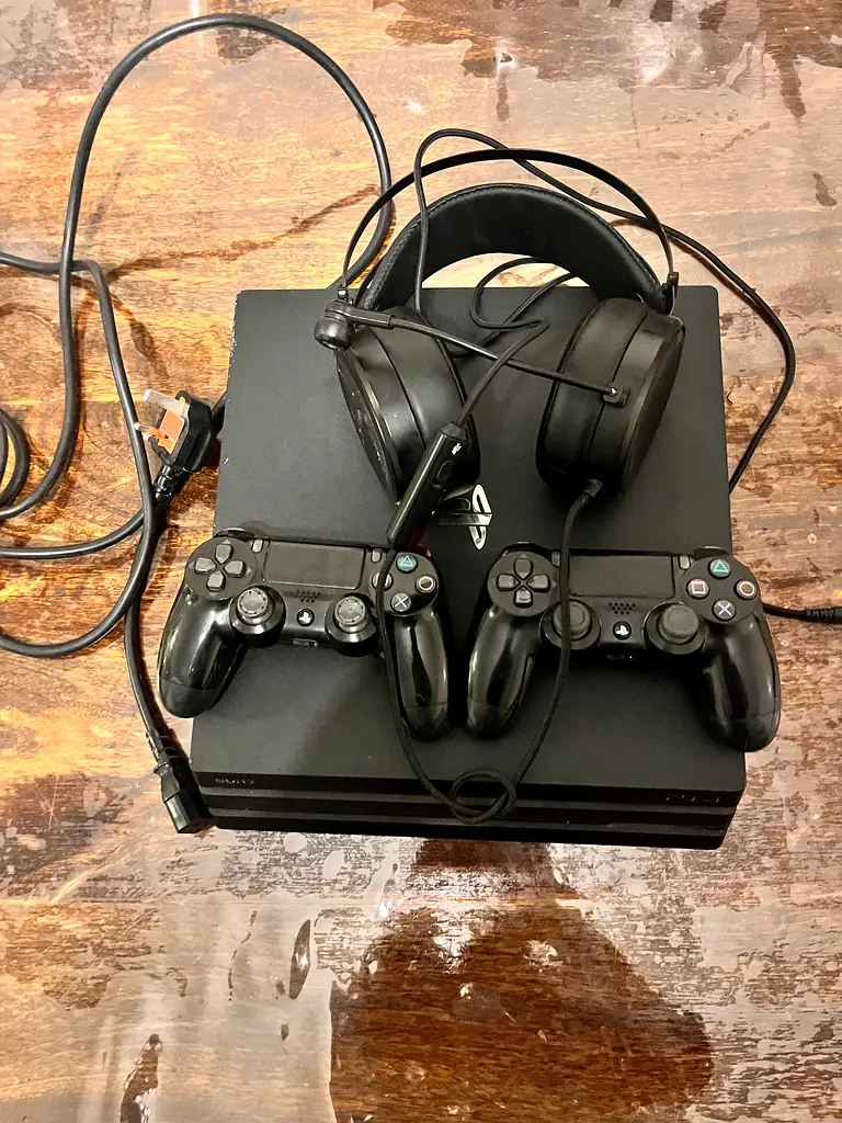 Gaming Bundle: PlayStation 4 Console with Dual Controllers  Headse