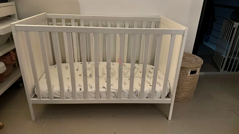IKEA cot for AED300 with mattress and mattress protector63207399672194110