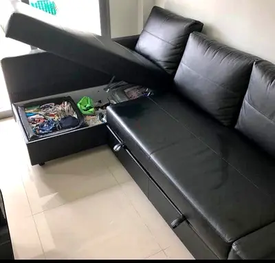 Black leather sofa bed with storage