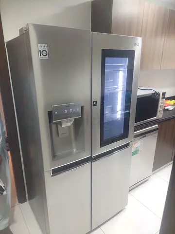 LG Premium InstaView Side by Side Refrigerator with Water Dispenser Ice Maker