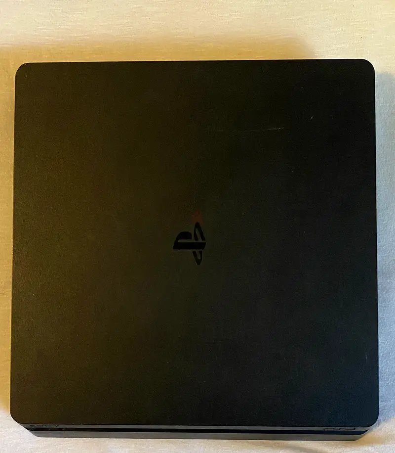PlayStation 4 Slim - Your Gateway to Gaming Adventures!
