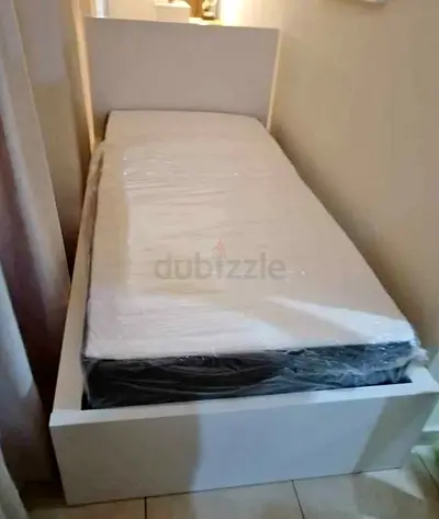 Ikea malam single bed 90/200 with  IKEA mattress is available in new condition,