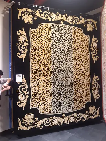 Elegant Black and Gold Animal Print Rug - Perfect for Your Home!