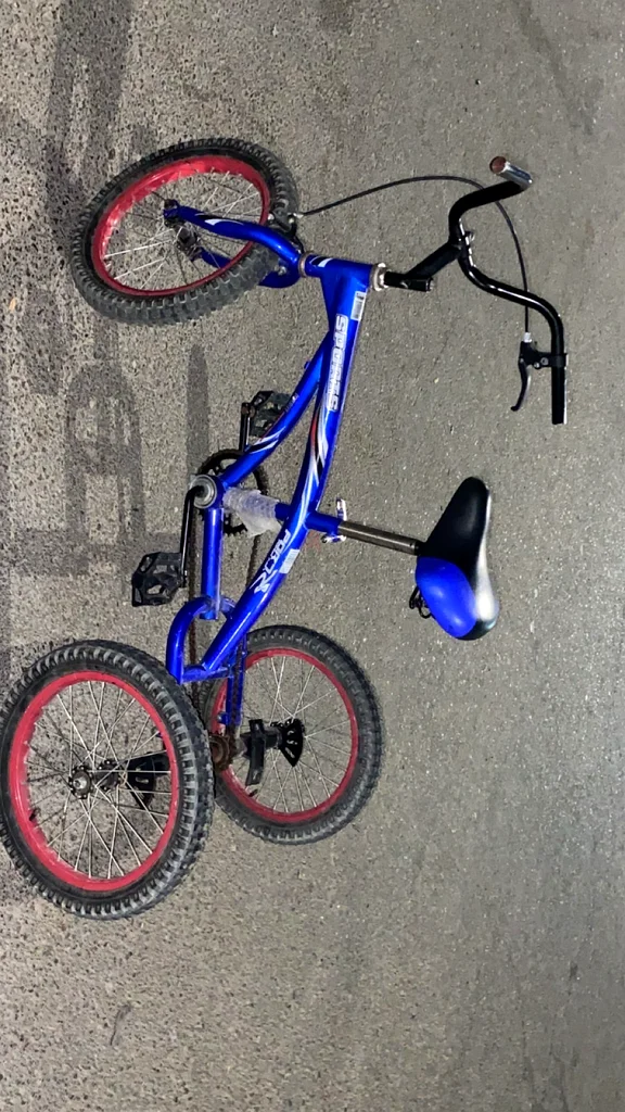 A blue three-wheeled bicycle.63245714652802111