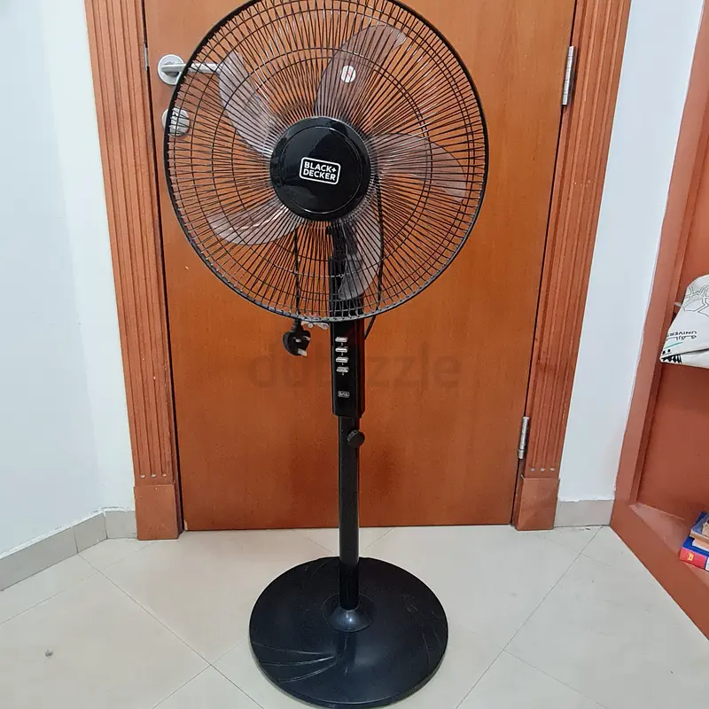Stay Cool with This Black Stand Fan - Perfect for Home Use!
