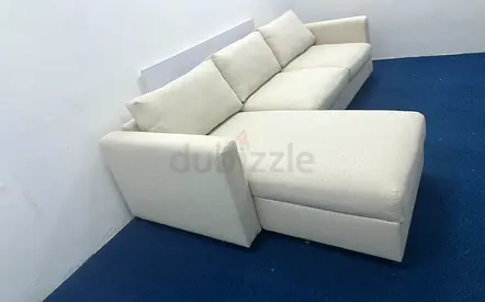 IKEA beige color lshape sofabed under storage