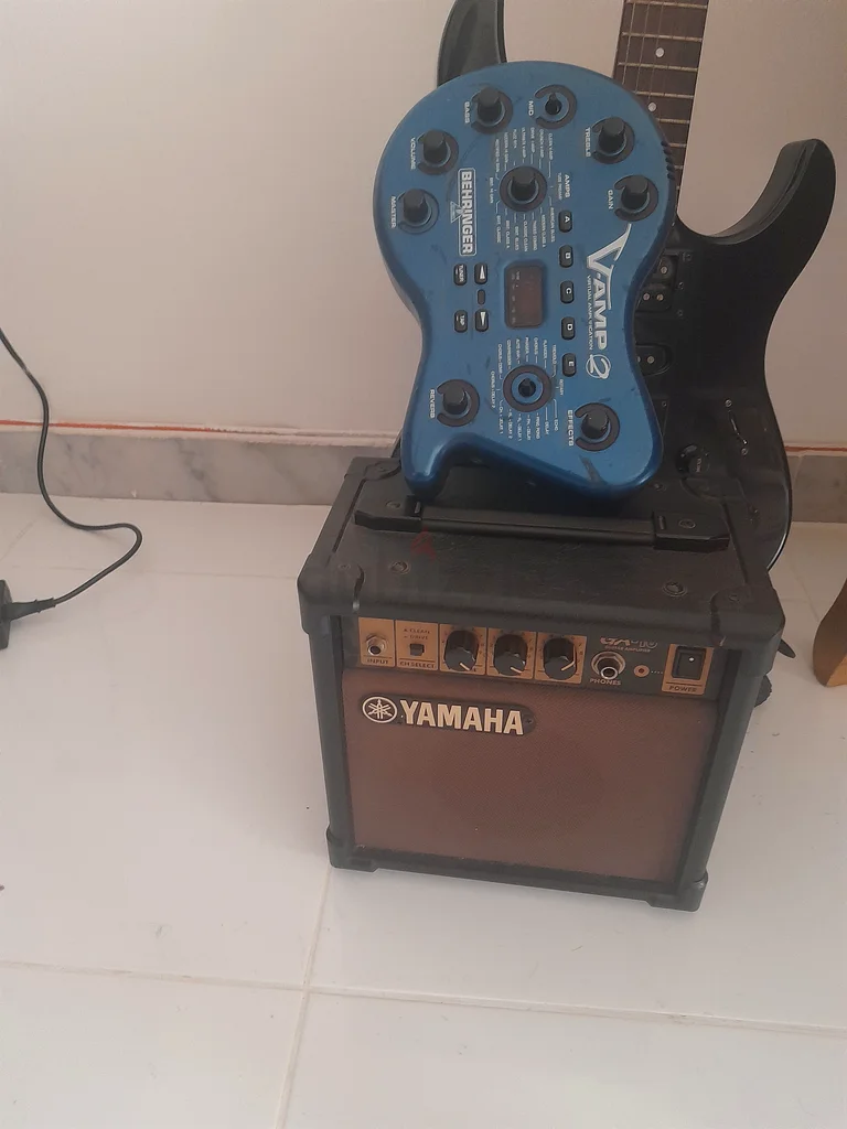 Sleek Black Electric Guitar - Perfect for Rock and Roll!  If interested only WhatsApp63205878203265112
