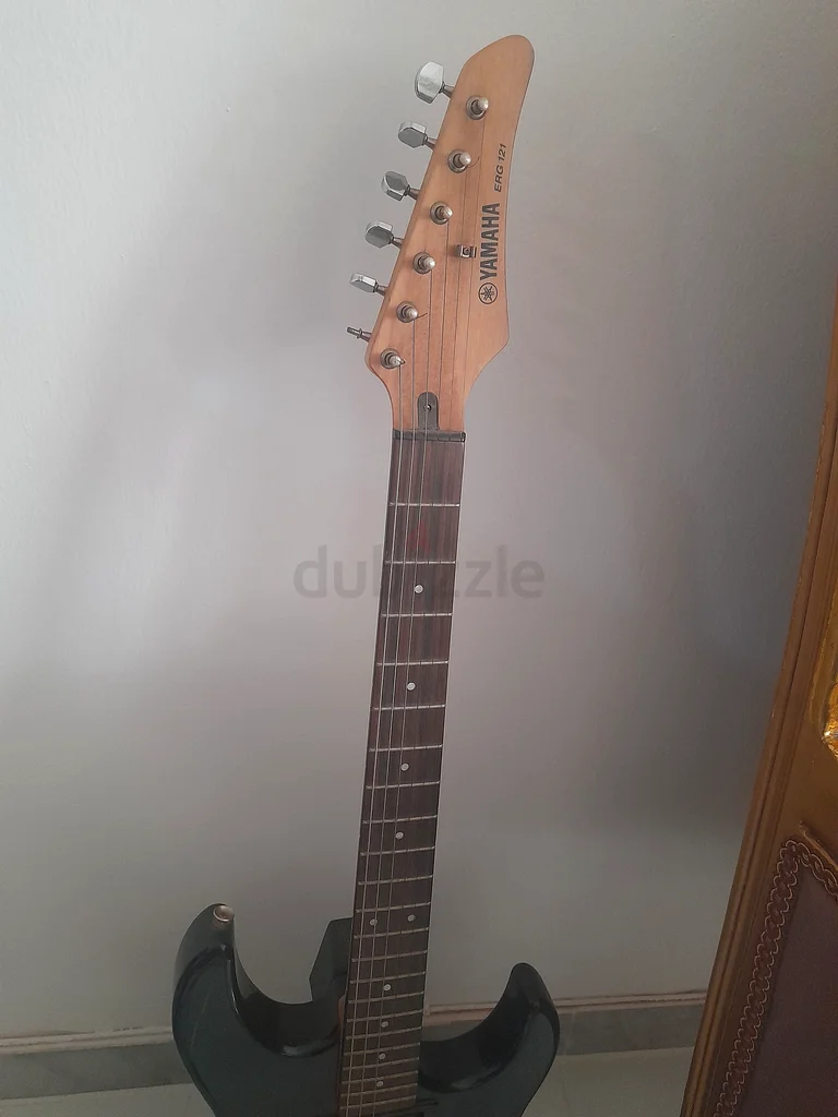 Sleek Black Electric Guitar - Perfect for Rock and Roll!  If interested only WhatsApp63205878203265111
