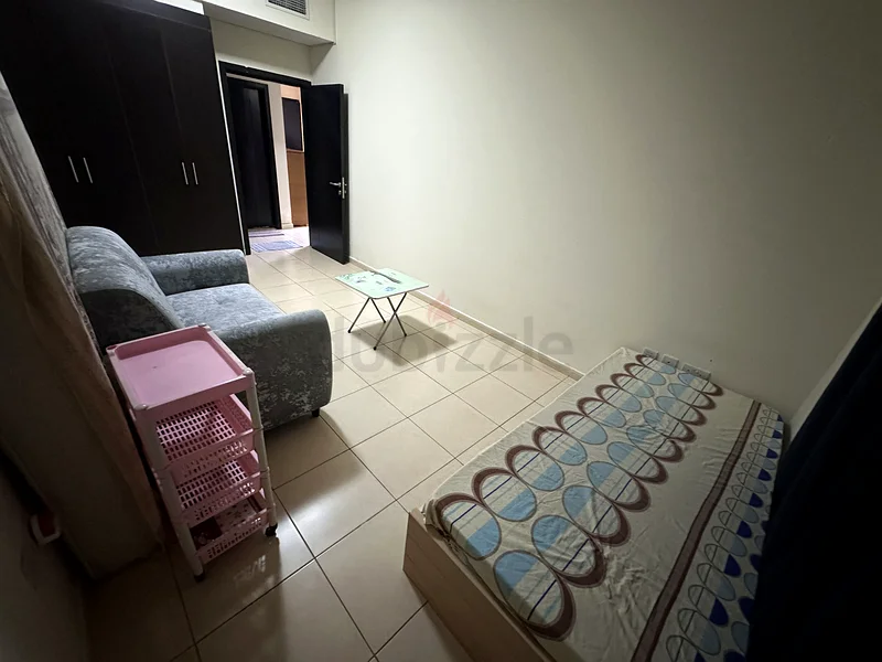 private bedroom for rent in 1BHK flat in Liwan/Queue point dubai62868789744643111