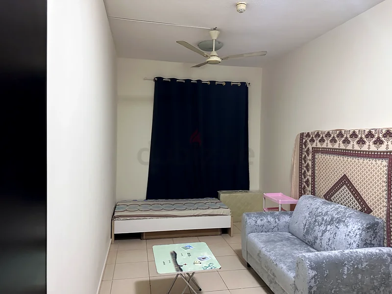 private bedroom for rent in 1BHK flat in Liwan/Queue point dubai62868789744643114