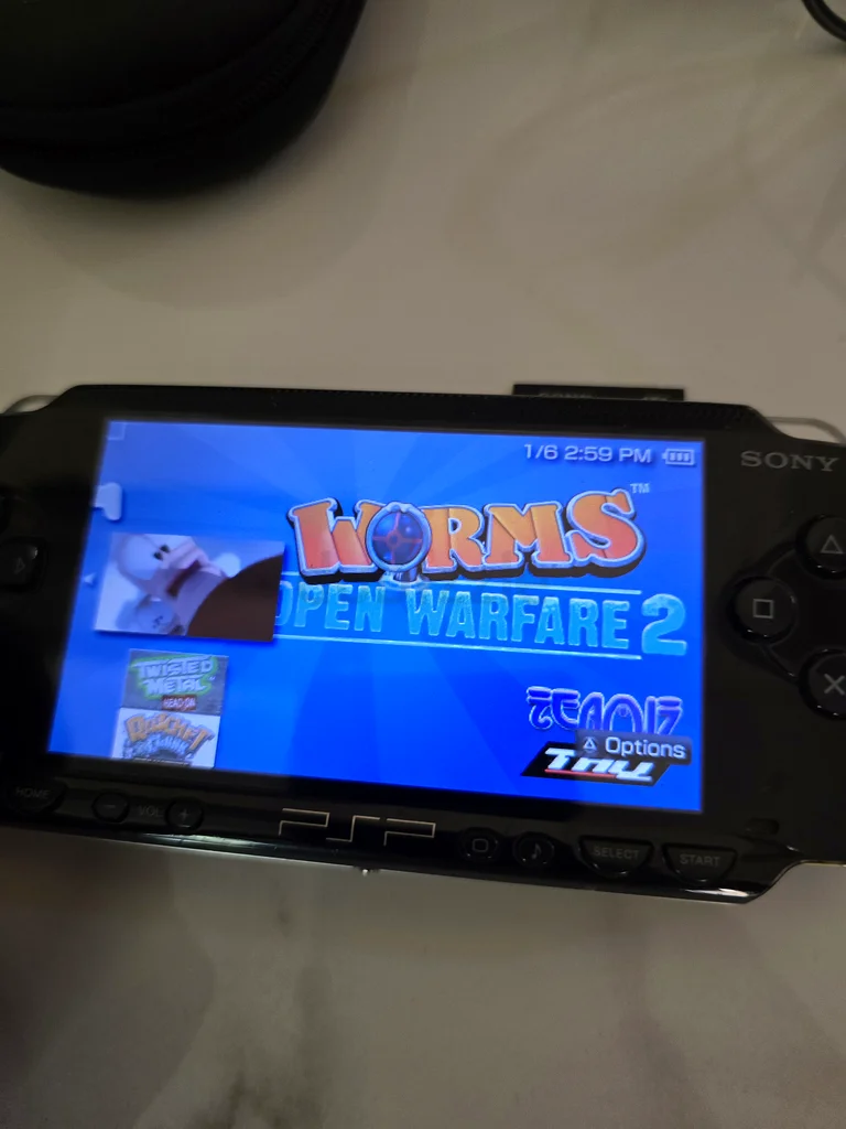 Sony PSP - 1000 (modded) with 70 games and 2 memory cards 64GB and 4GB original with case63230710174721114