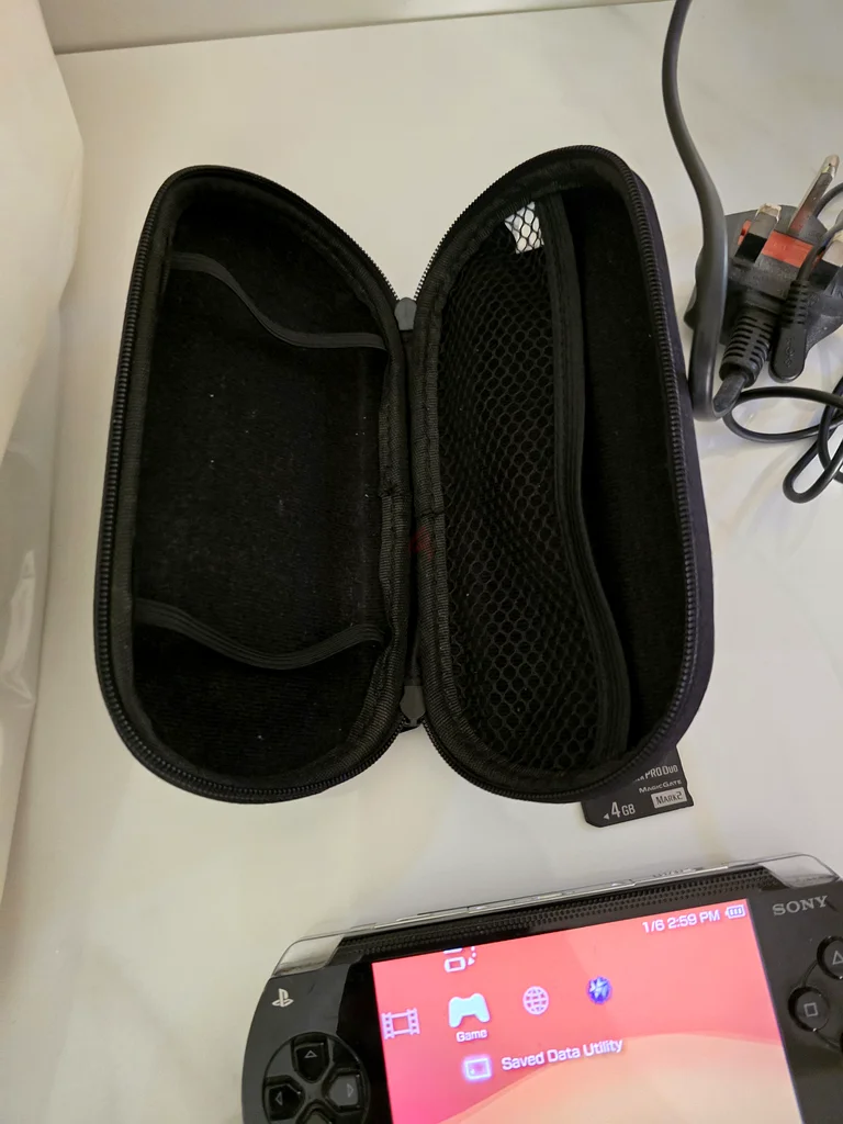 Sony PSP - 1000 (modded) with 70 games and 2 memory cards 64GB and 4GB original with case63230710174721113