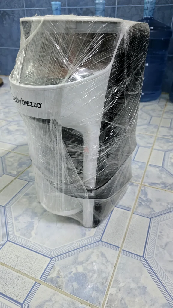 Arabic stroller for twins, 2 car seats for children, and a milk maker device.63176195845249112