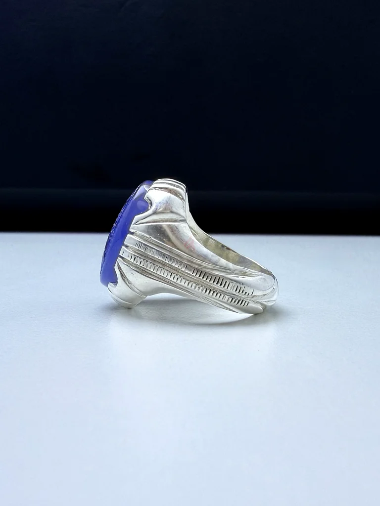 A ring with a blue Yemeni agate stone, engraved63174324114433114