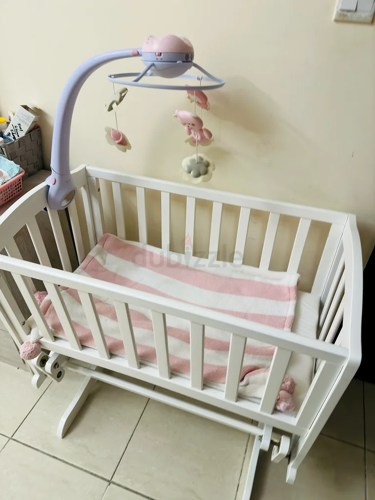 Charming White Rocking Cradle with Melodic Mobile from Giggles Brand63204862877443112