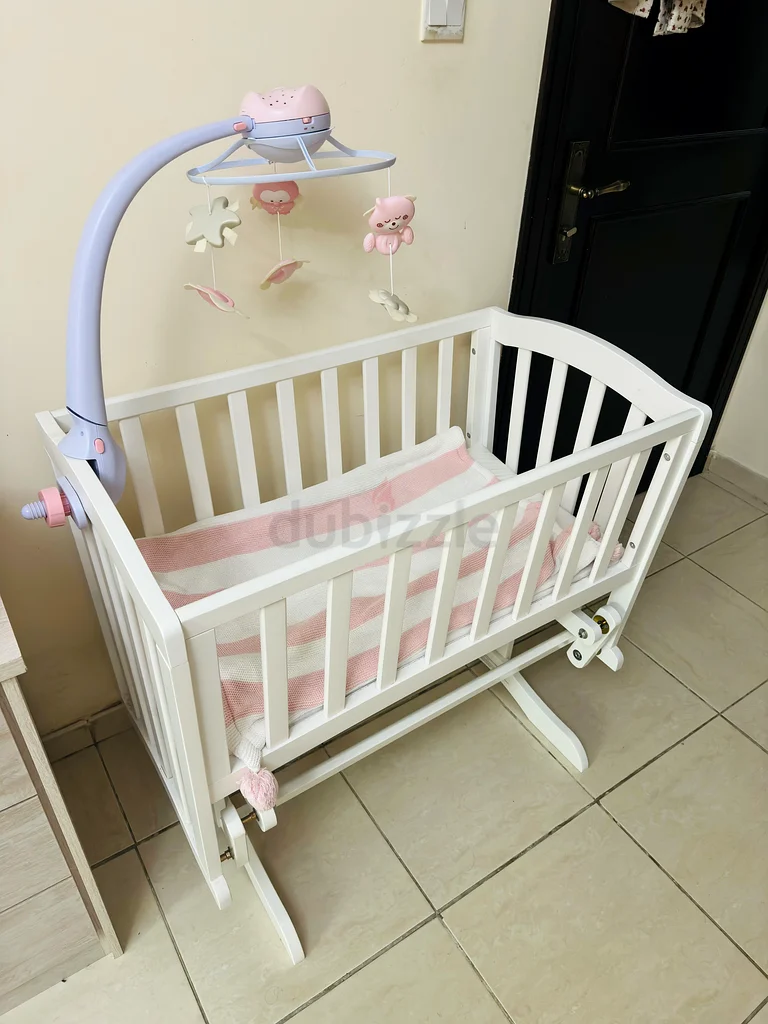 Charming White Rocking Cradle with Melodic Mobile from Giggles Brand63204862877443111