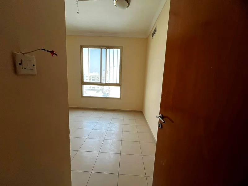 Two-bedroom apartment with balcony and built-in closets in Al Qulai’a, available with flexible 4-cheque payment plan.62890342131331114