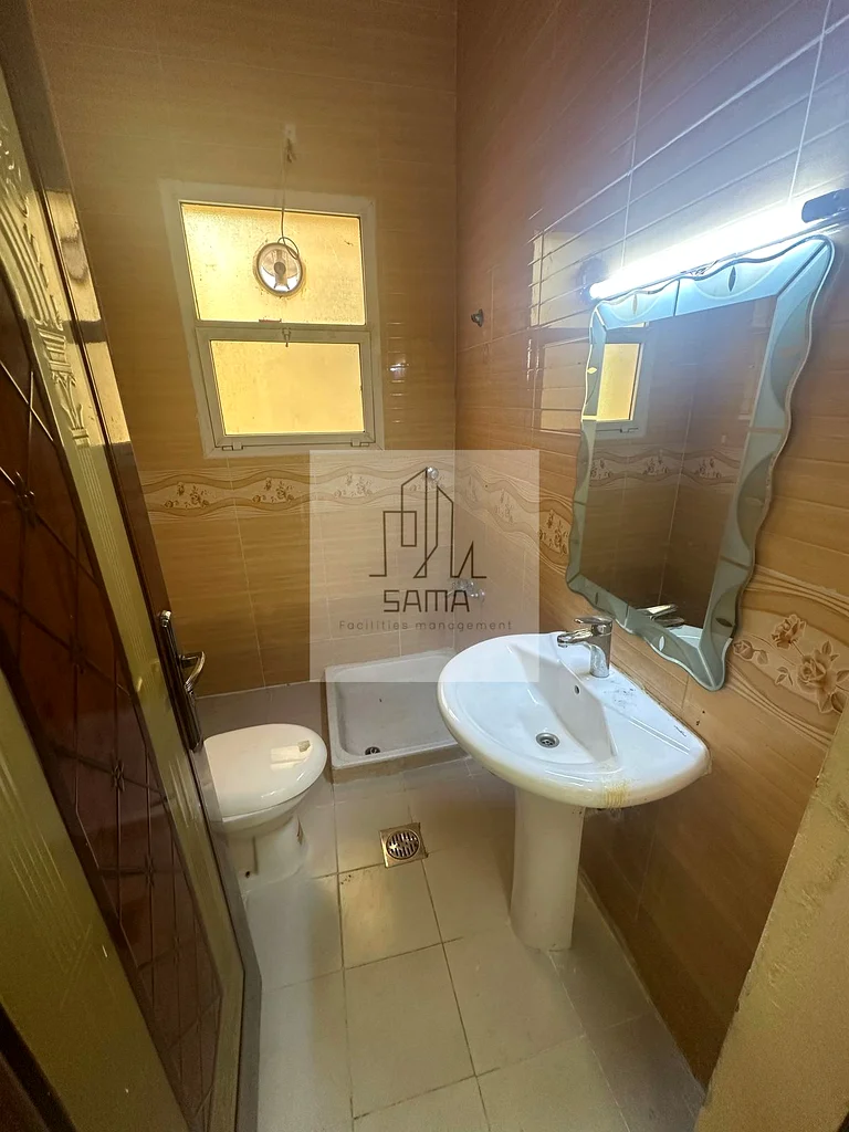 Two rooms, a living room, a kitchen, and two bathrooms within a building in the Al-Matawah area.62868800251265111