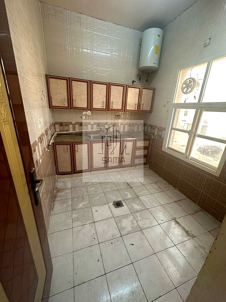 Two rooms, a living room, a kitchen, and two bathrooms within a building in the Al-Matawah area.62868800251265112