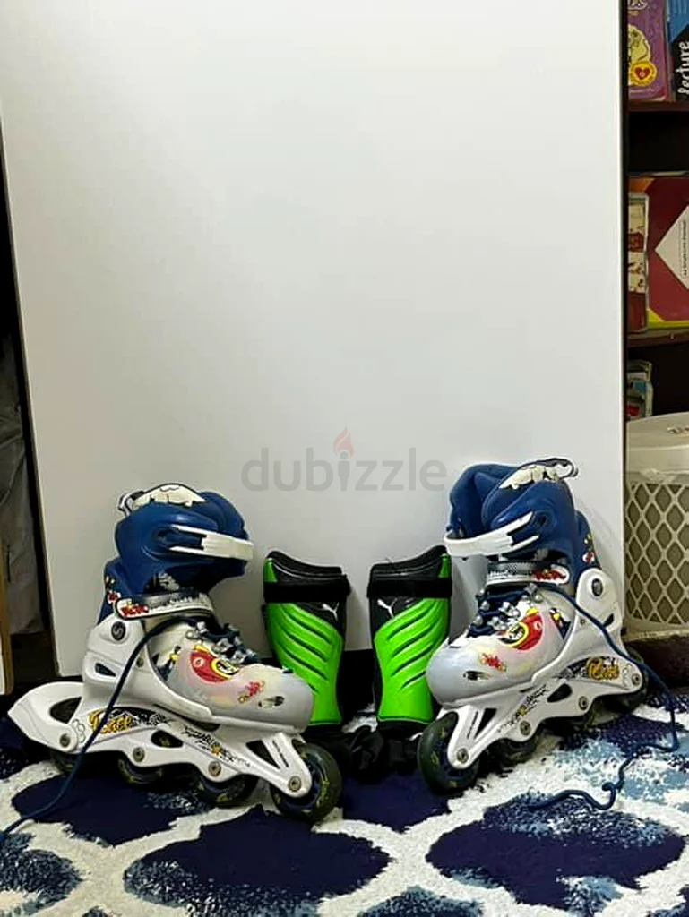 Wheel shoes in Great condition along with shin pads.63246246338562110