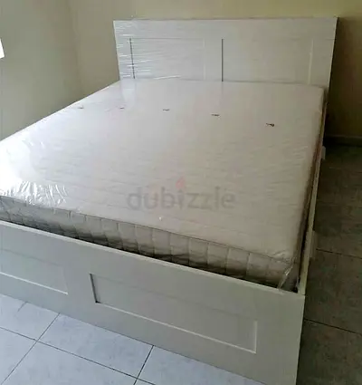 Ikea brimness king bed with headboard 4  drawers underneath and Ikea mattress .  Only 4 month used (