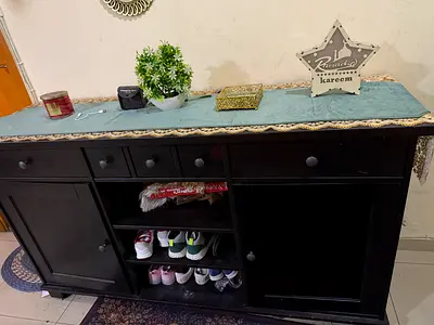Elegant Dark Wood Storage Cabinet with Decorative Touch