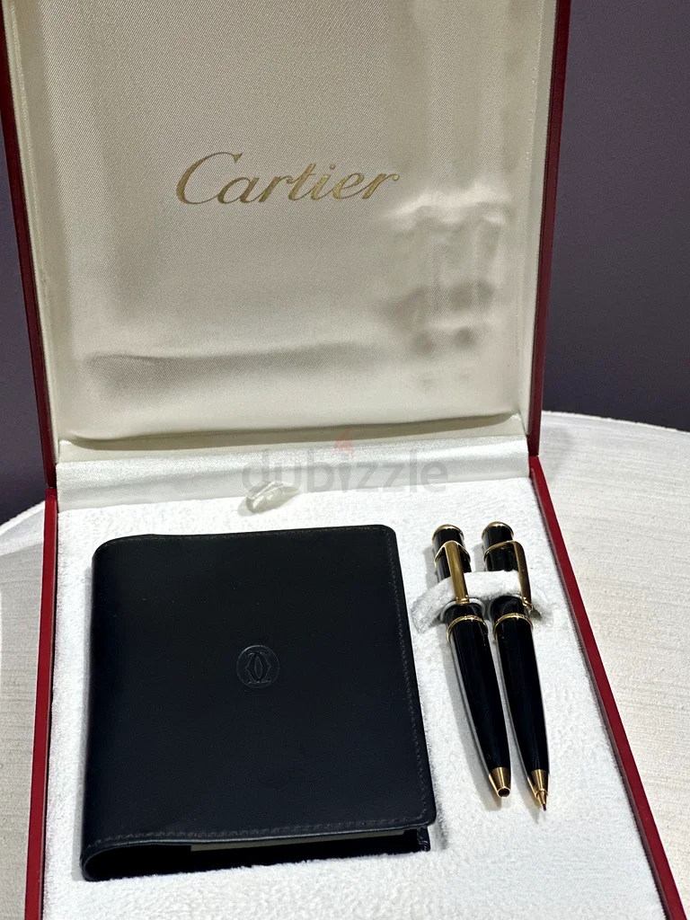 قلمان حبر من كارتييه وقلم رصاص مستعمل مع دفتر كامل.63223850316930113