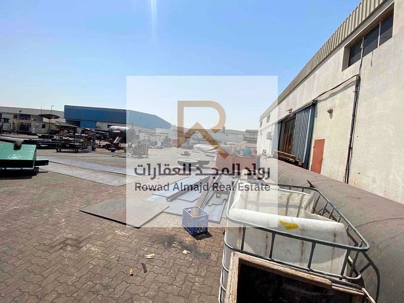 Freehold Warehouse for sale with a fenced plot of land in Emirates Industrial City63195597952257114