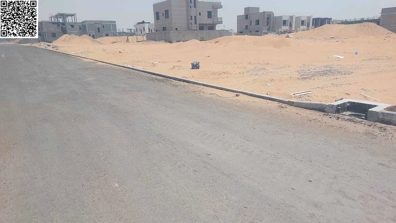 For sale, a corner plot of land on two streets in Ajman, Al Helio 1 area, freehold for all nationalities, excellent location63196091635075111