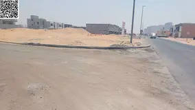 For sale, land in Ajman, Al Helio area, opposite Azhi Zawba, two streets, paved streets, freehold fo