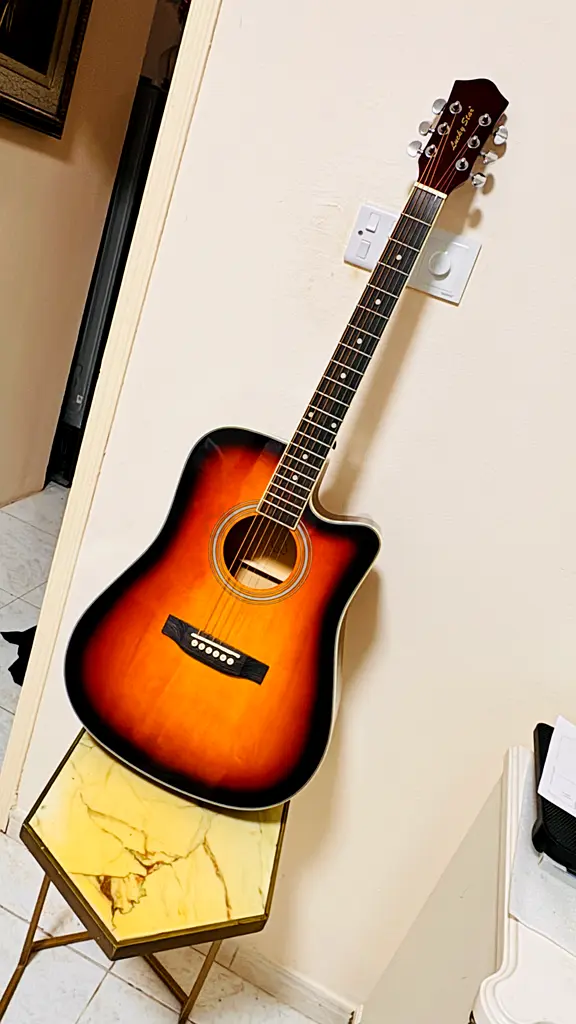 Striking Acoustic Guitar - Perfect for Music Lovers!