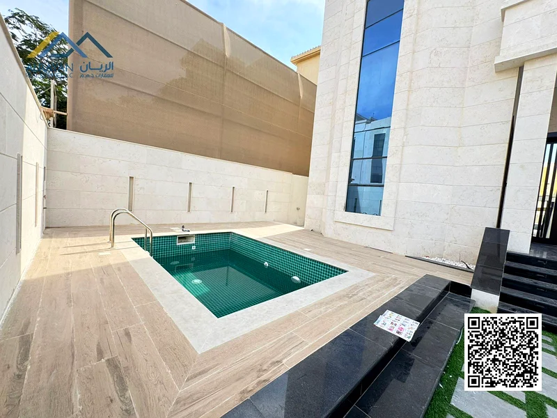 Luxurious villa with a large swimming pool, 5000 square feet, in Al Rawda area, freehold for all nationalities63874051375873113