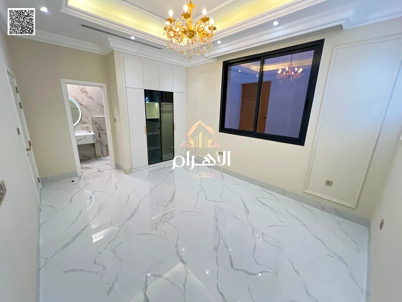 فيلا فاخرة بتصميم كلاسيكي في موقع ممتاز أمام مجمع أذها، وبسعر يشمل رسوم التسجيل ونقل الملكية، بدون63902225275779114