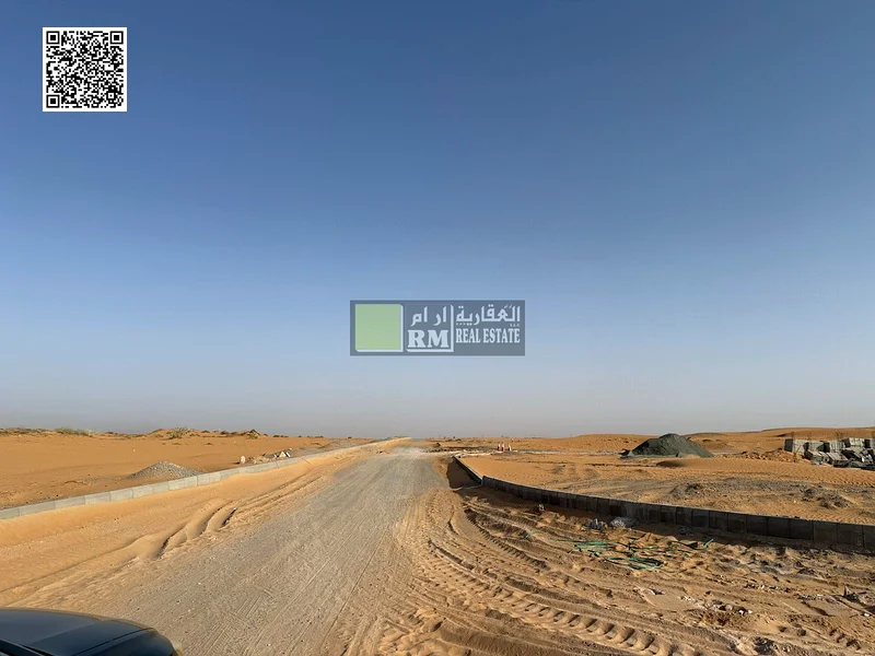 RESIDENTIAL VILLA PLOT FOR SALE ON THE MAIN ROAD I "Residential Lands for Sale in the Largest Project in Umm Al Quwain – Basatin Al Serra"63185196457473111