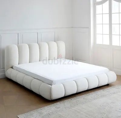 Stylish Cream Fabric Bed with Plush Design