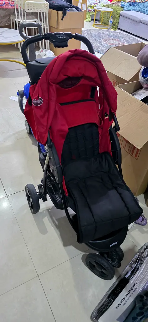 Stylish Red Stroller for Comfort and Convenience AED 100