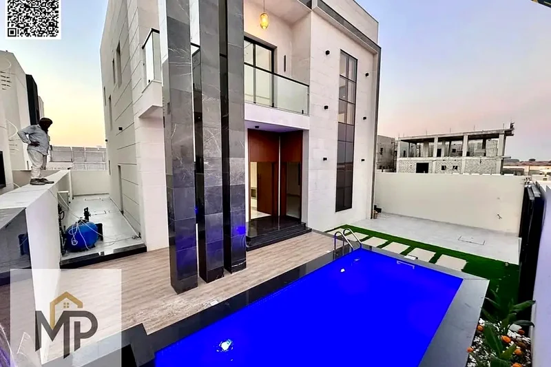 For sale - a luxury villa with a swimming pool in a prime location in Ajman, high-end finishing, modern design, including registration and swimming63904246619650110