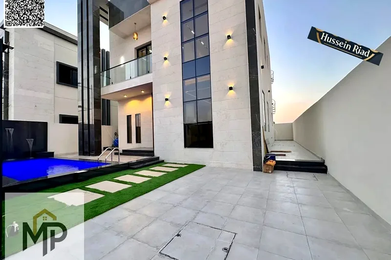 For sale - a luxury villa with a swimming pool in a prime location in Ajman, high-end finishing, modern design, including registration and swimming63904246619650111